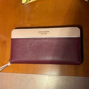 Kate spade wallet. Brand new with tags. Maroon and pink